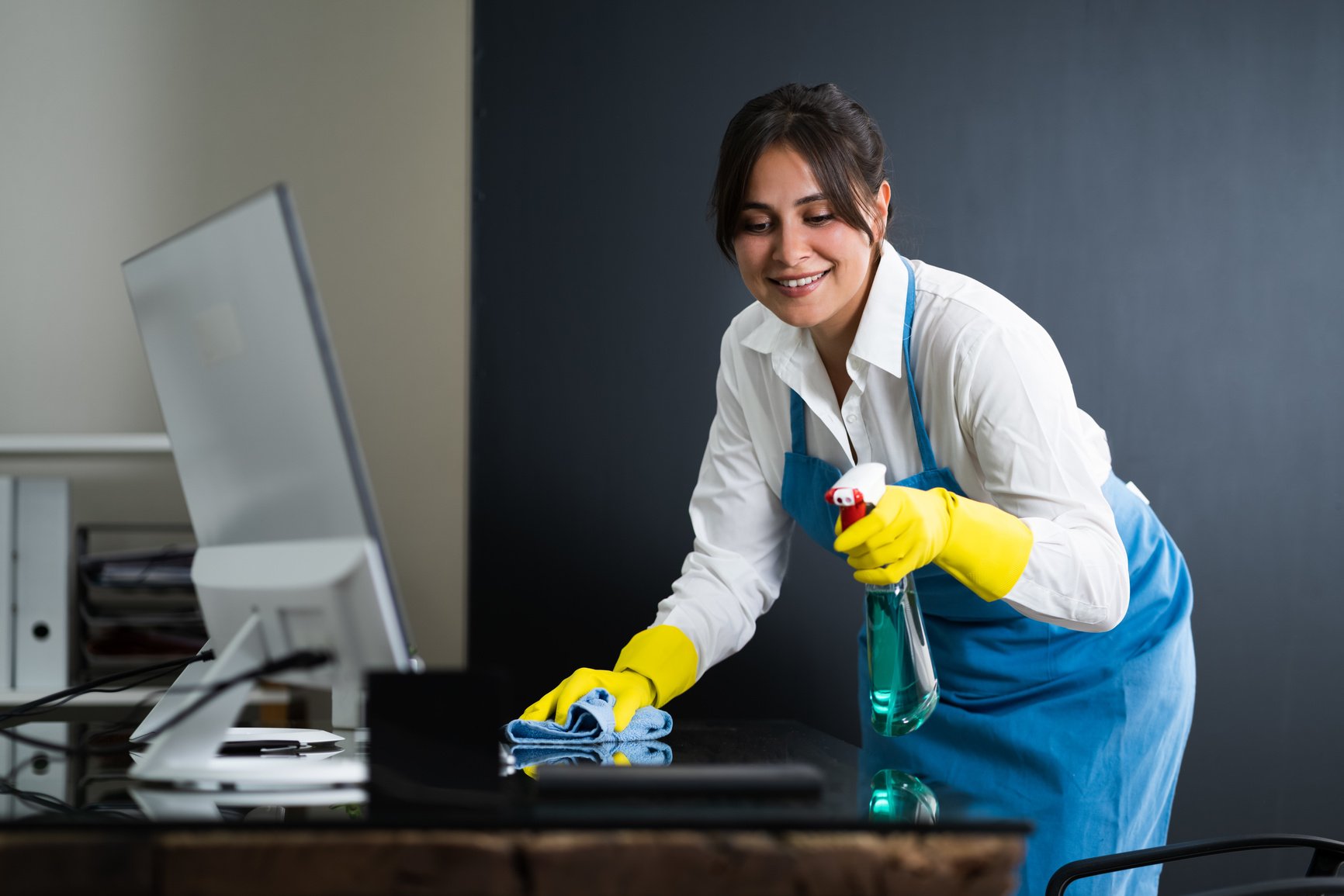 Janitor Cleaning Office Desk